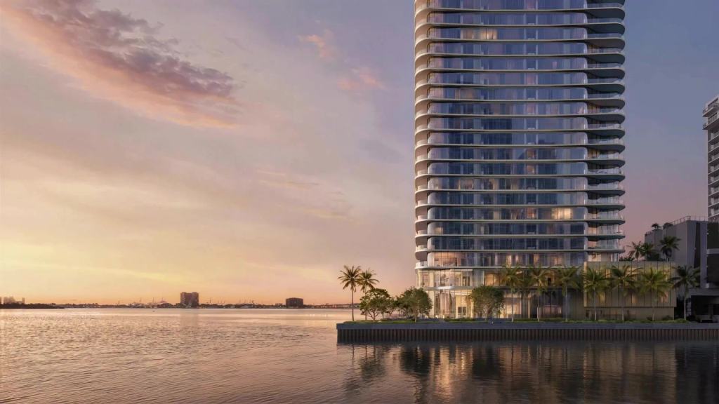 LILLI Edgewater luxury waterfront condominiums in Miami, a condo tower overlooking Biscayne Bay at sunset