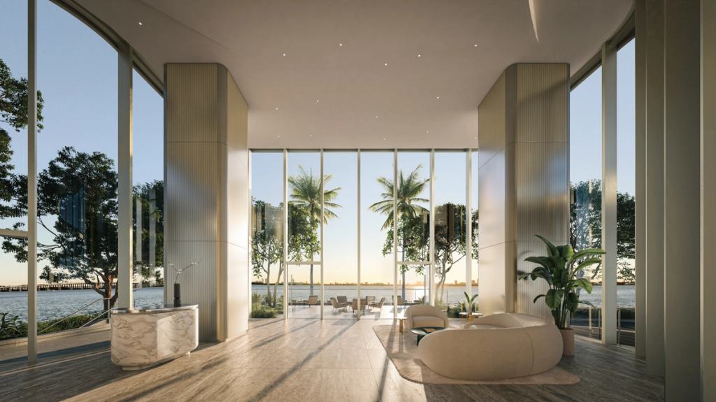 A lobby with floor-to-ceiling windows, overlooking Biscayne Bay