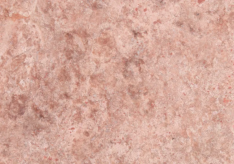 Kırmızı Traverten kırmızı-pembe tonlu gözenekli doğal taş doku yakın plan