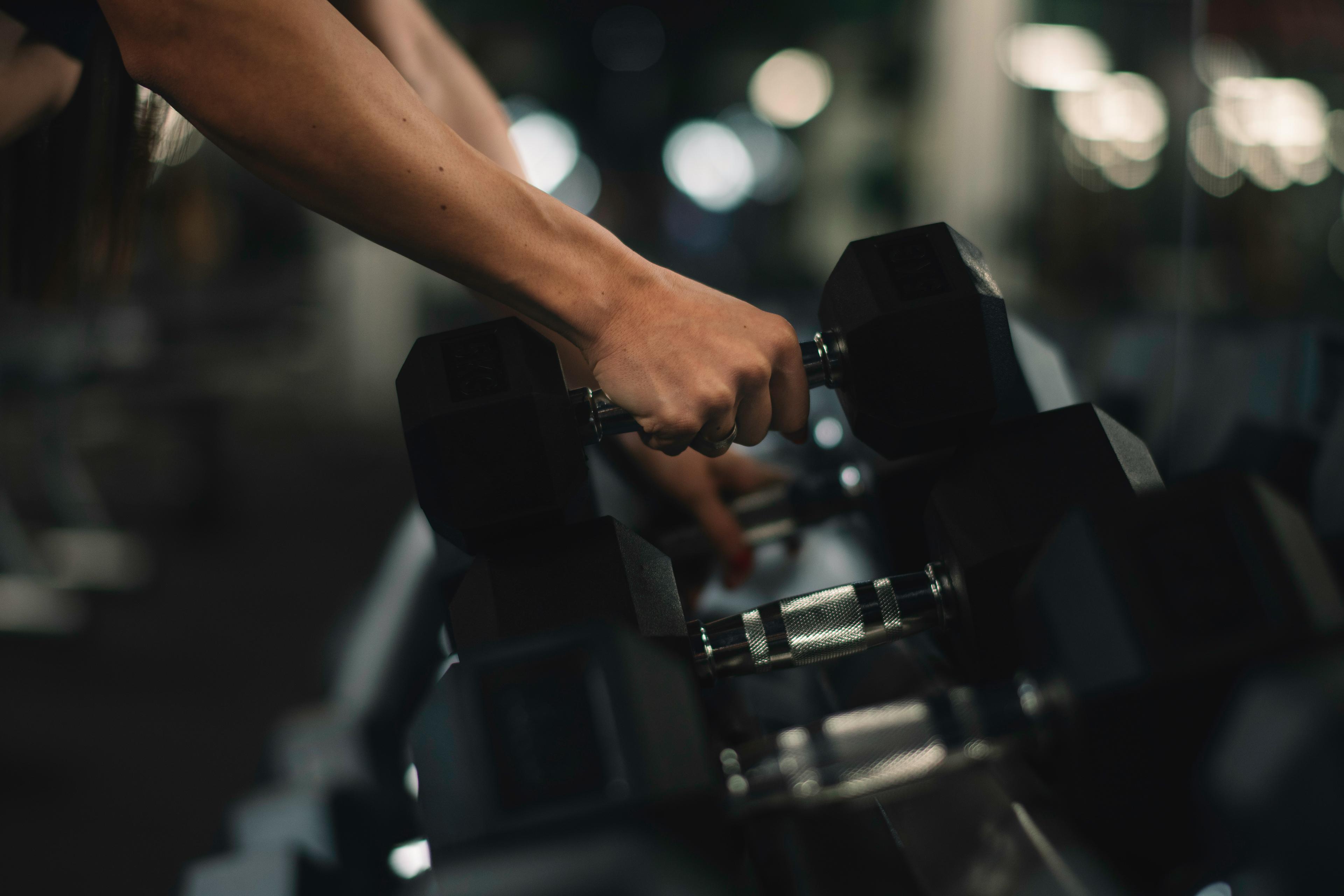 The fitness room is equipped with weights and cardio machines such as treadmills.