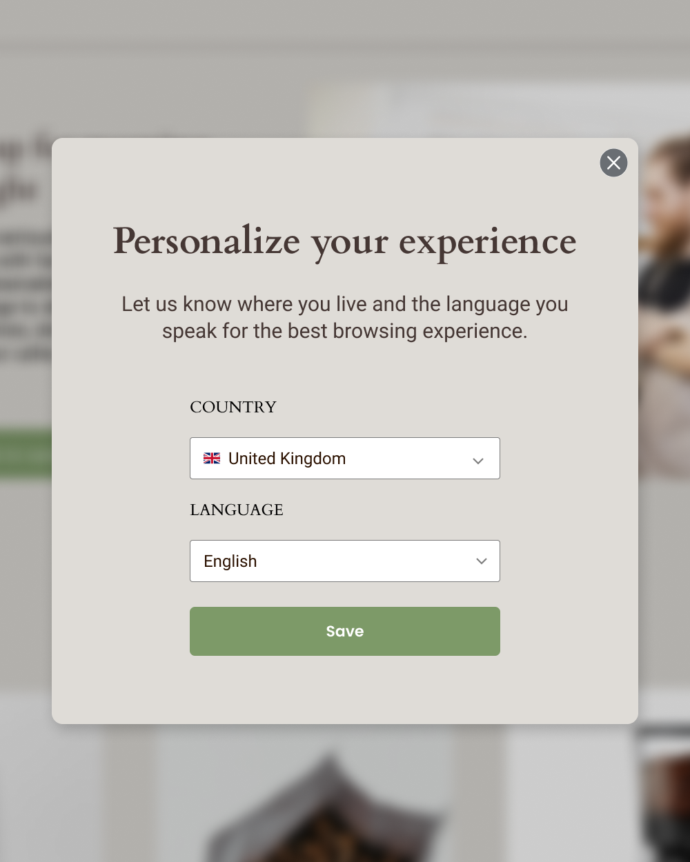 A website pop-up titled “Personalize your experience” prompts users to select their country and language from dropdown menus, showing United Kingdom and English selected, with a green “Save” button below.