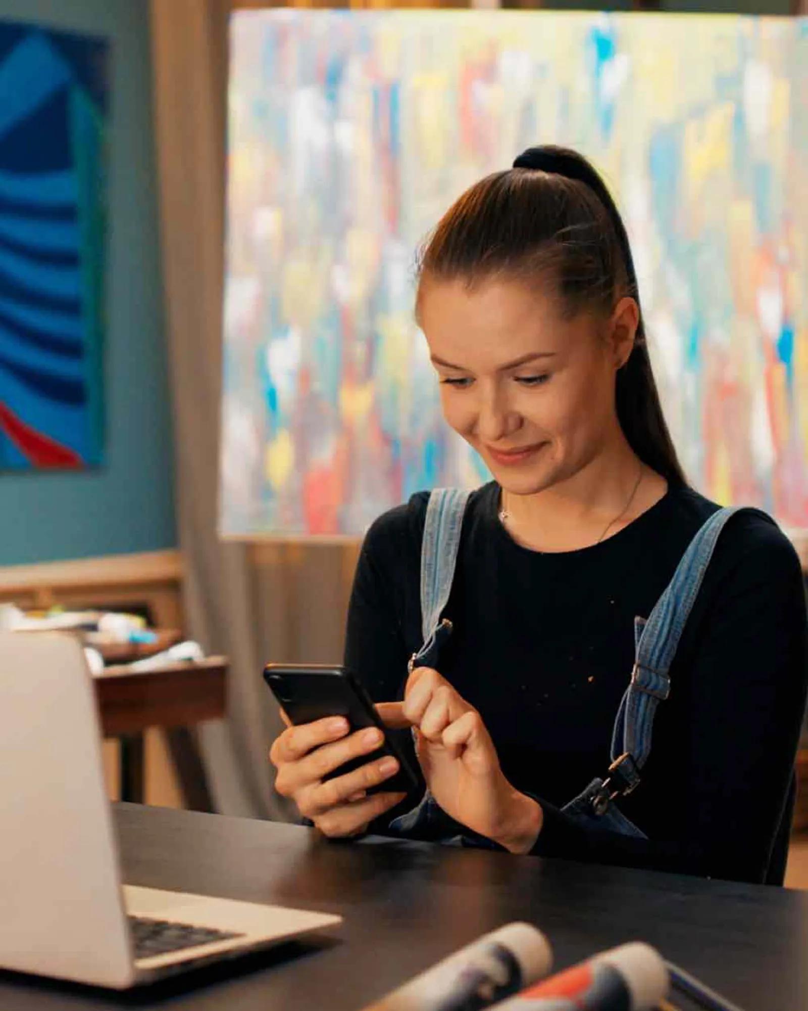 Woman scrolling on her phone.