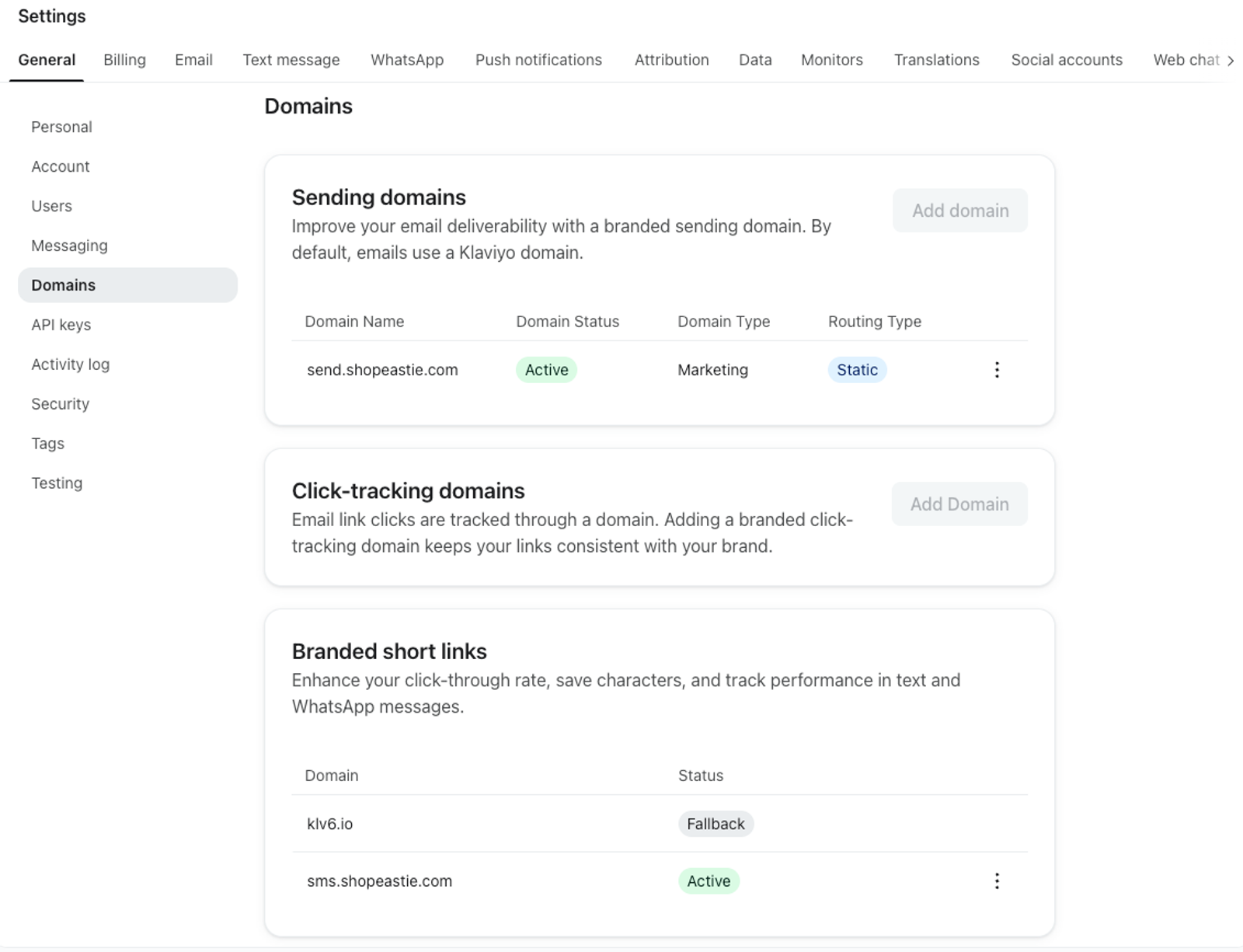 A settings page for Domains, showing configurations for sending domains, click-tracking domains, and branded short links, with `send.shopeastle.com` and `sms.shopeastle.com` listed as active.