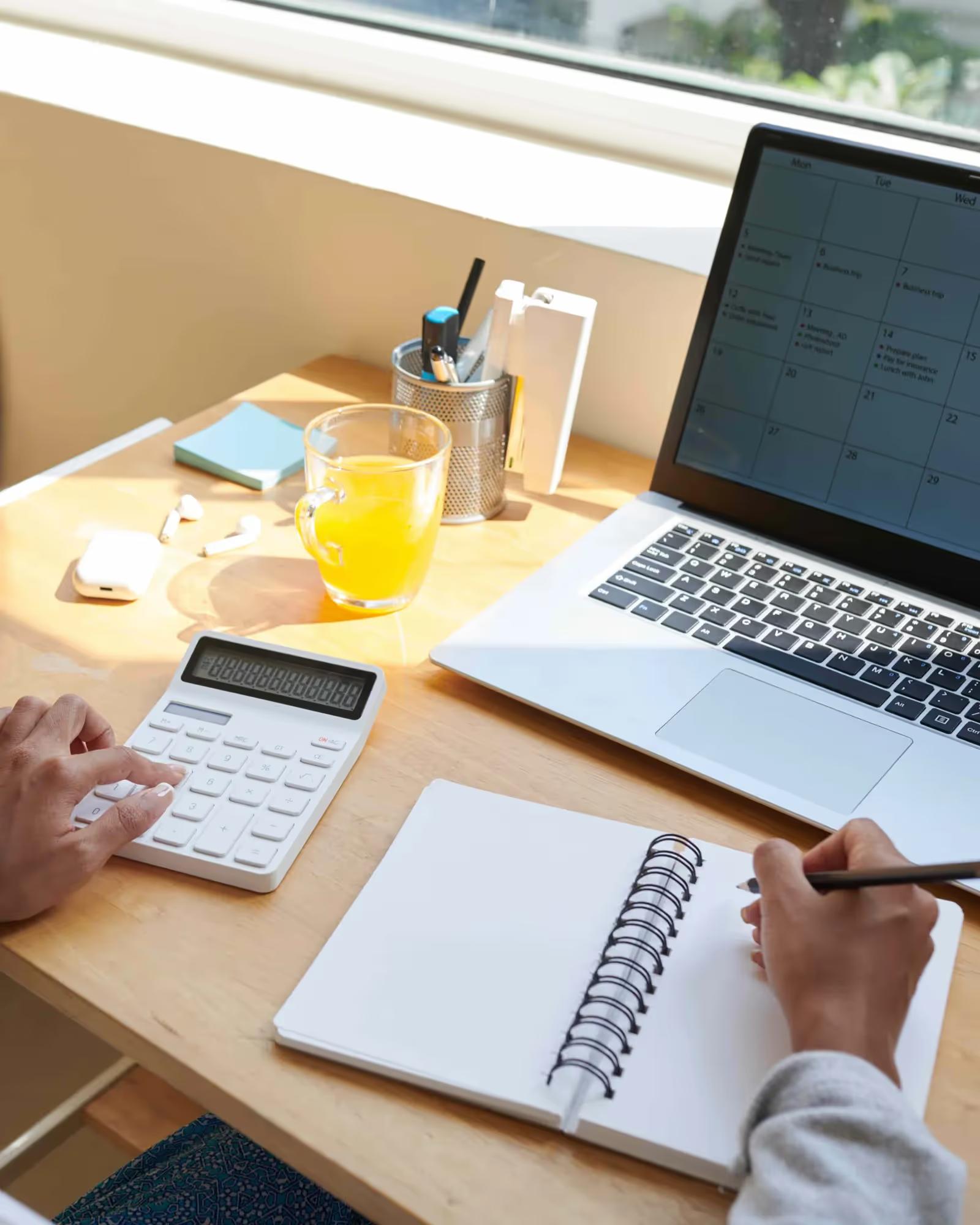 Someone putting together an audit plan at their computer.