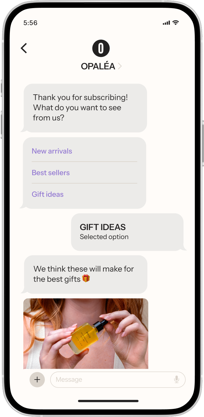 Smartphone showing a chat with OPALEA. The user selected "Gift ideas" and received a photo of a person holding a yellow product bottle.