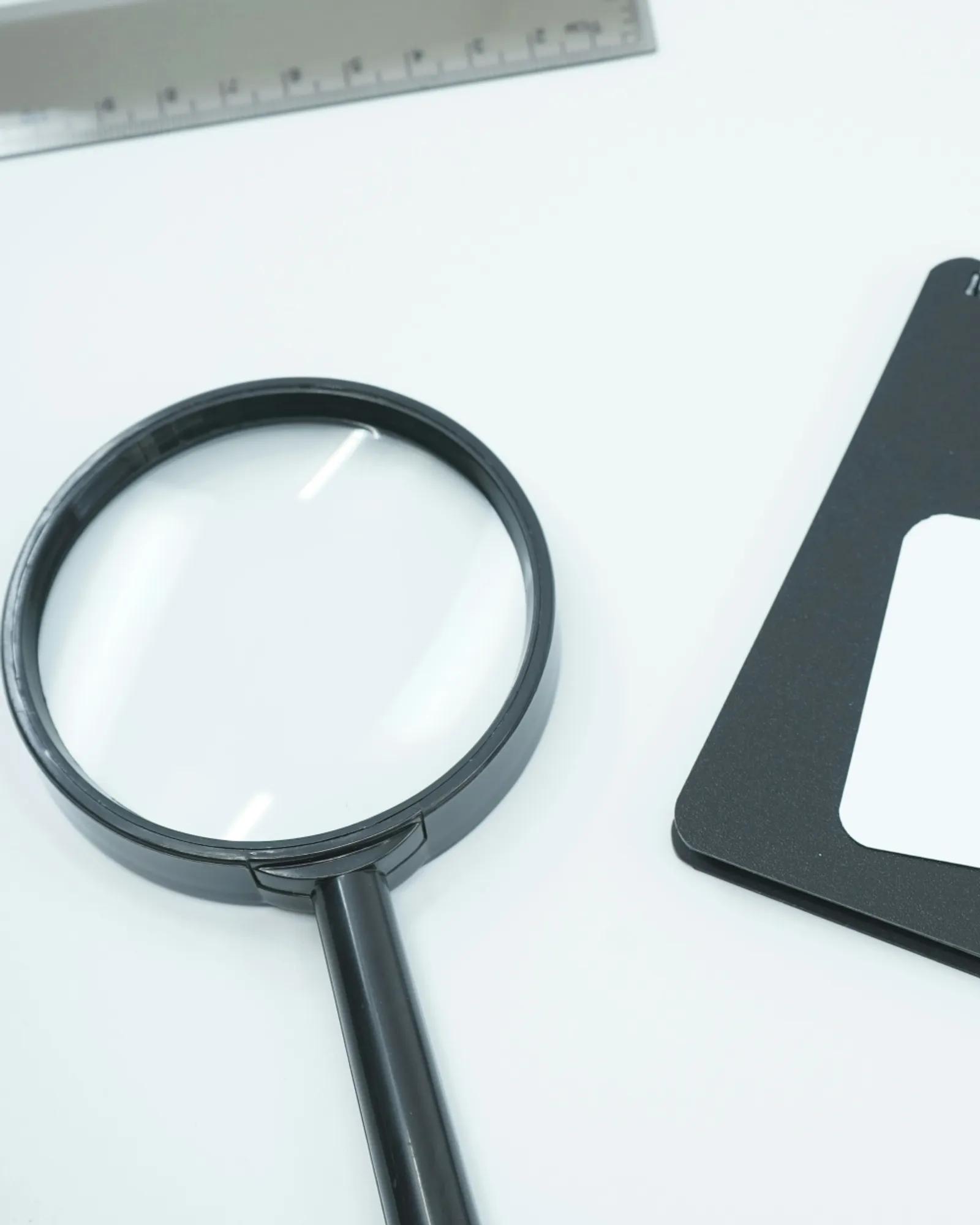 a magnifying glass on a desk