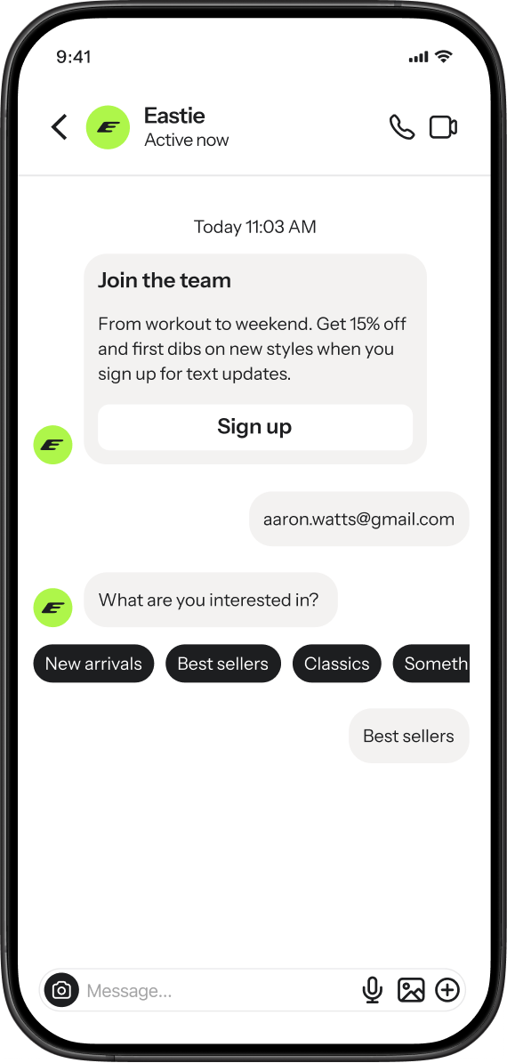 A mobile phone screen displays a chat interface with a brand named "Eastie," showing a promotional message to "Join the team" with a "Sign up" button, a user's email address as a reply, and interactive buttons offering choices like "New arrivals" and "Best sellers," with "Best sellers" highlighted as chosen.