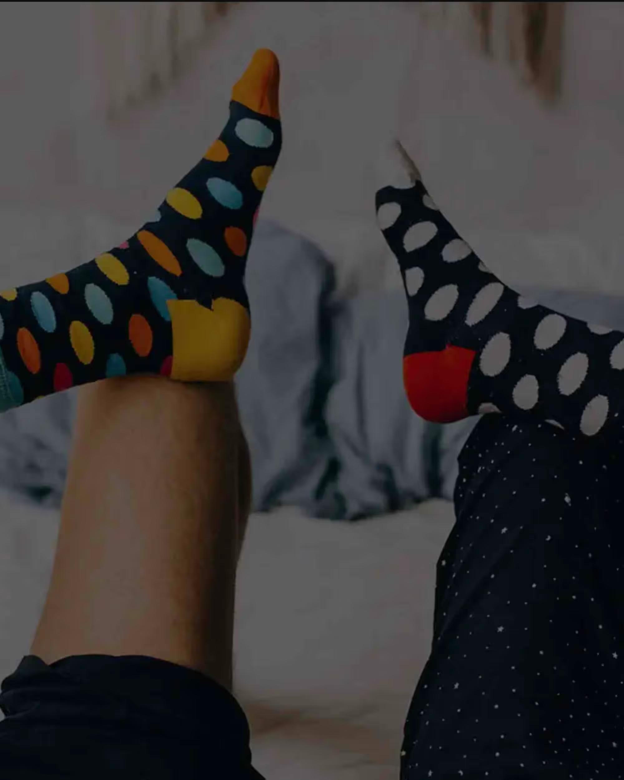 Two people wearing Pair of Thieves socks.