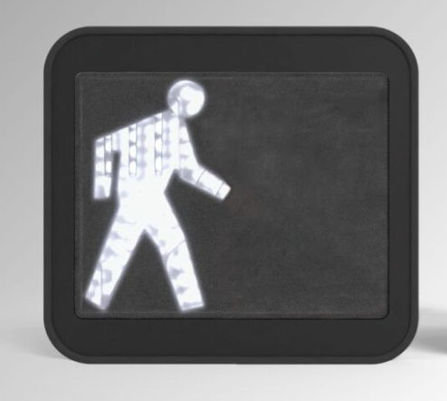 An illuminated pedestrian traffic signal showing a white "walk" symbol on a black screen, framed in black.