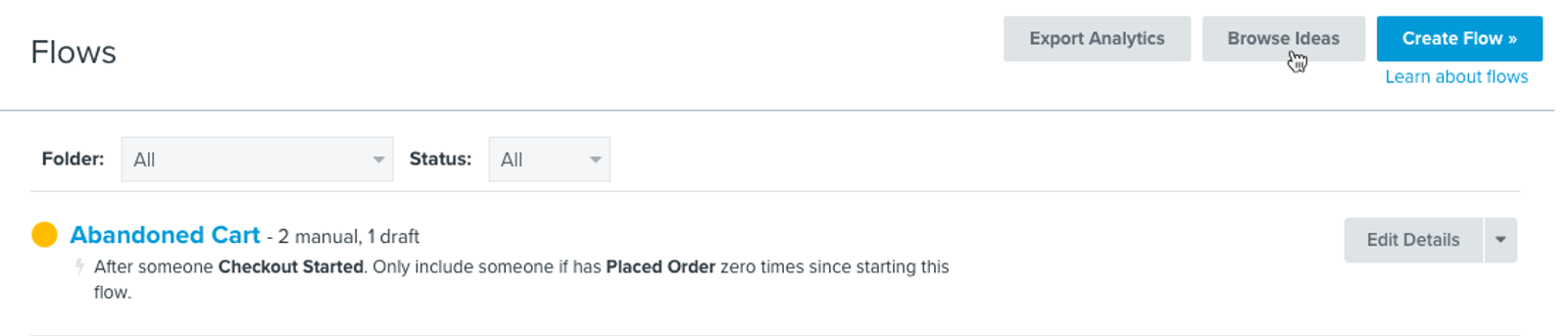 Flows tab in Klaviyo showing Abandoned Cart flow in list with yellow status