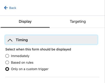 The Timing section of the Targeting and behaviors tab in the form editor showing the option to Show on a custom trigger selected.