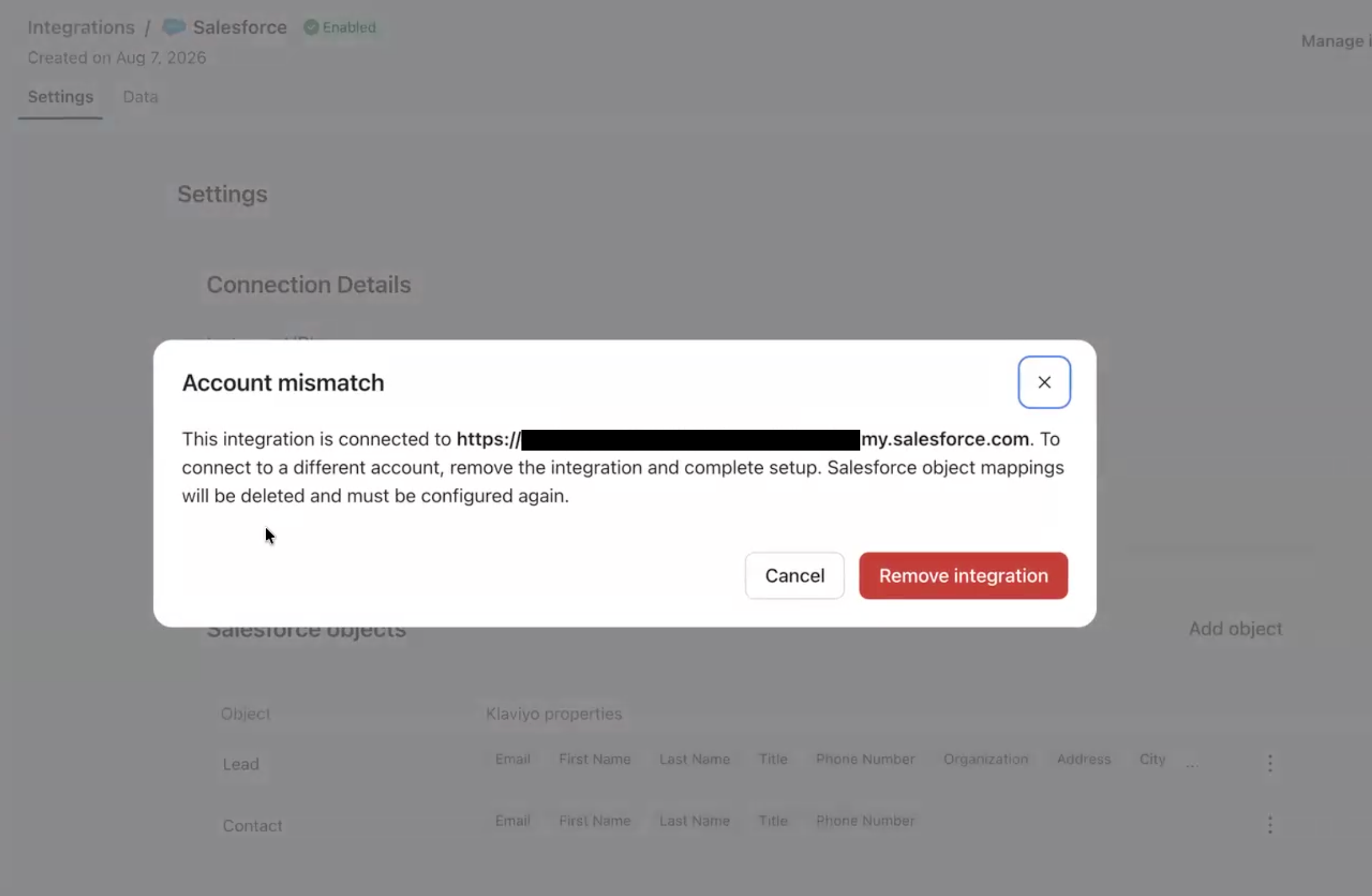 A pop-up dialog box titled "Account mismatch" explains that the integration is connected to a specific Salesforce account and must be removed to connect a different one, with "Cancel" and "Remove integration" buttons.