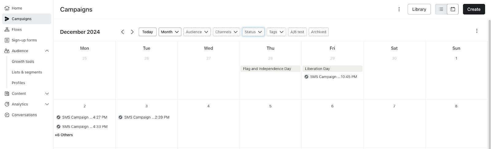 Calendar view of campaigns for December 2024 showing example SMS campaigns scheduled on various dates