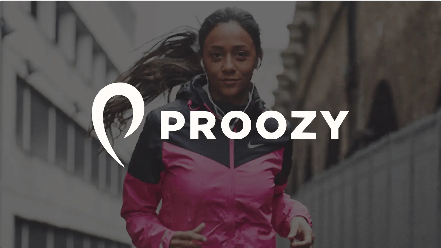 A woman running in a two-tone Nike windbreaker with headphones on a city street, overlaid with the Proozy logo