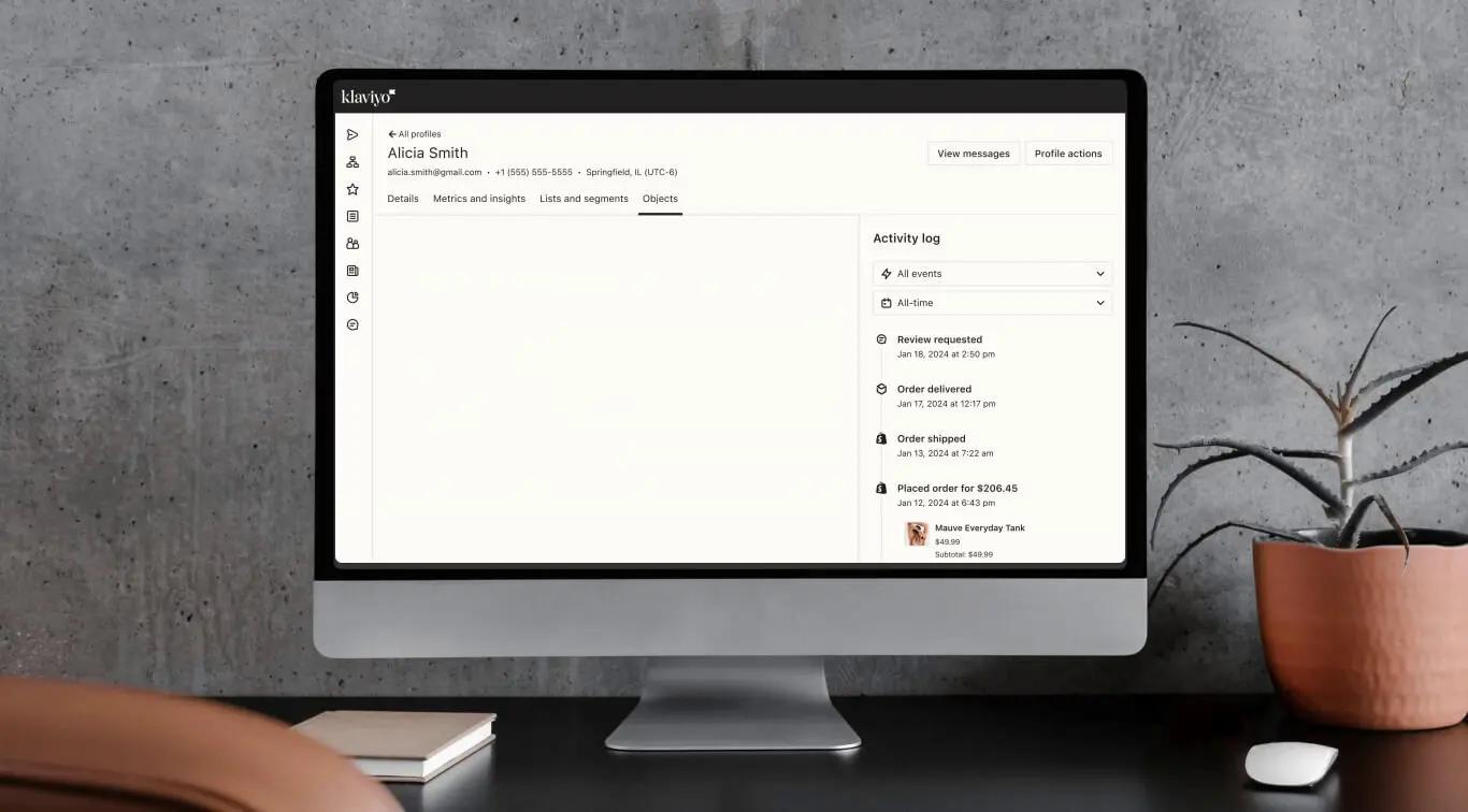 Graphic represents a complete customer profile within the Klaviyo platform. Profile details include which channels the customer has opted in to and activity log.
