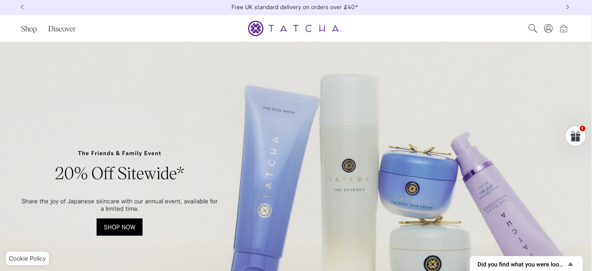 Image shows a screenshot of the Tatcha homepage, which features a hero image of several Tatcha skincare products displayed against a soft cream background. The copy across the image reads, "20% Off Sitewide" as part of the Friends & Family Event, followed by the text, "Share the joy of Japanese skincare with our annual event, available for a limited time." The copy is followed by a "Shop Now" CTA button.