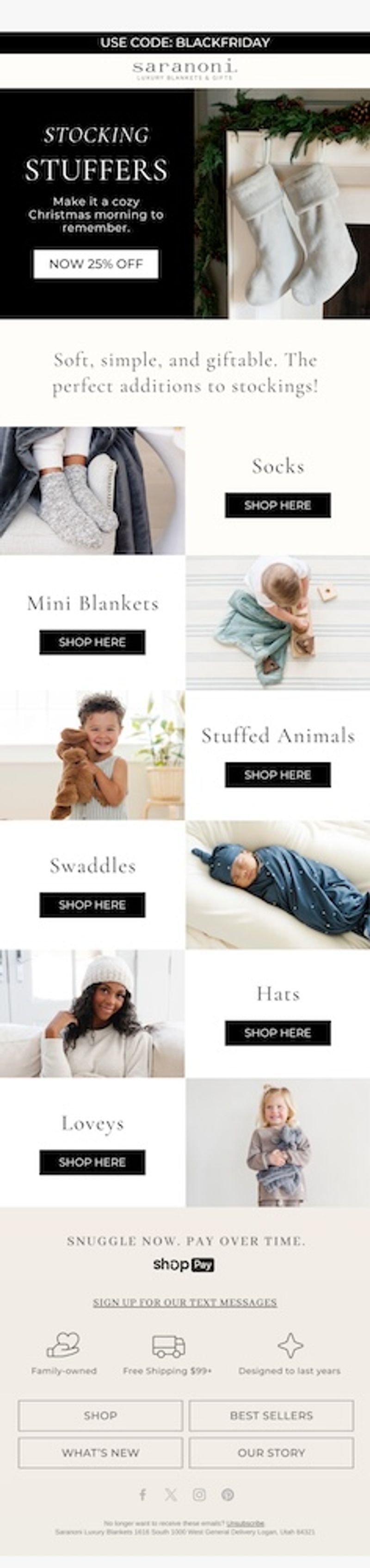 Image shows an email from Saranoni with a black banner at the top that reads, "Use code: BLACKFRIDAY" above the Saranoni logo. The hero section features white text on a black background that reads, "Stocking stuffers: Make it a cozy Christmas morning to remember," with a "Now 25% Off" CTA button underneath. On the right, two fluffy white stockings hang from a fireplace mantel decorated with pine garland and pinecones. Below the hero, a line of text reads, "Soft, simple, and giftable. The perfect additions to stockings!" The email then shows product sections in a grid. The first is socks, with a photo of someone's feet in gray knit socks resting on a chair next to a gray blanket, followed by a "Shop Here" CTA button. The second is mini blankets, with a photo of a toddler playing with wooden toys on a striped rug while holding a small blue blanket, followed by a "Shop Here" CTA button.