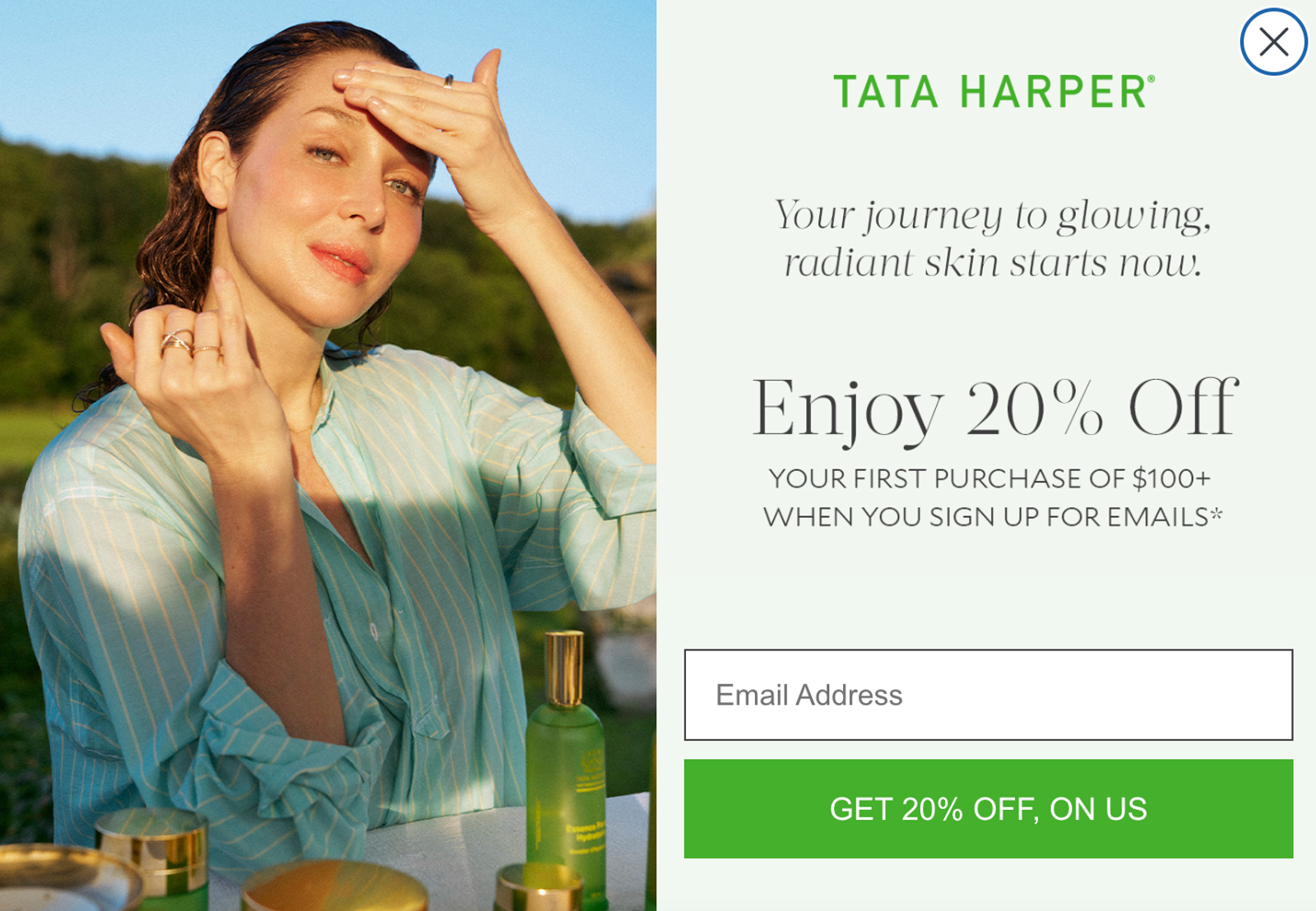 Tata Harper skincare popup featuring a radiant woman applying product and offering 20% off for email sign-up.