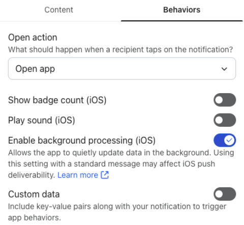 App notification behavior settings for iOS, showing options for open action, badge count, sound, background processing, and custom data.