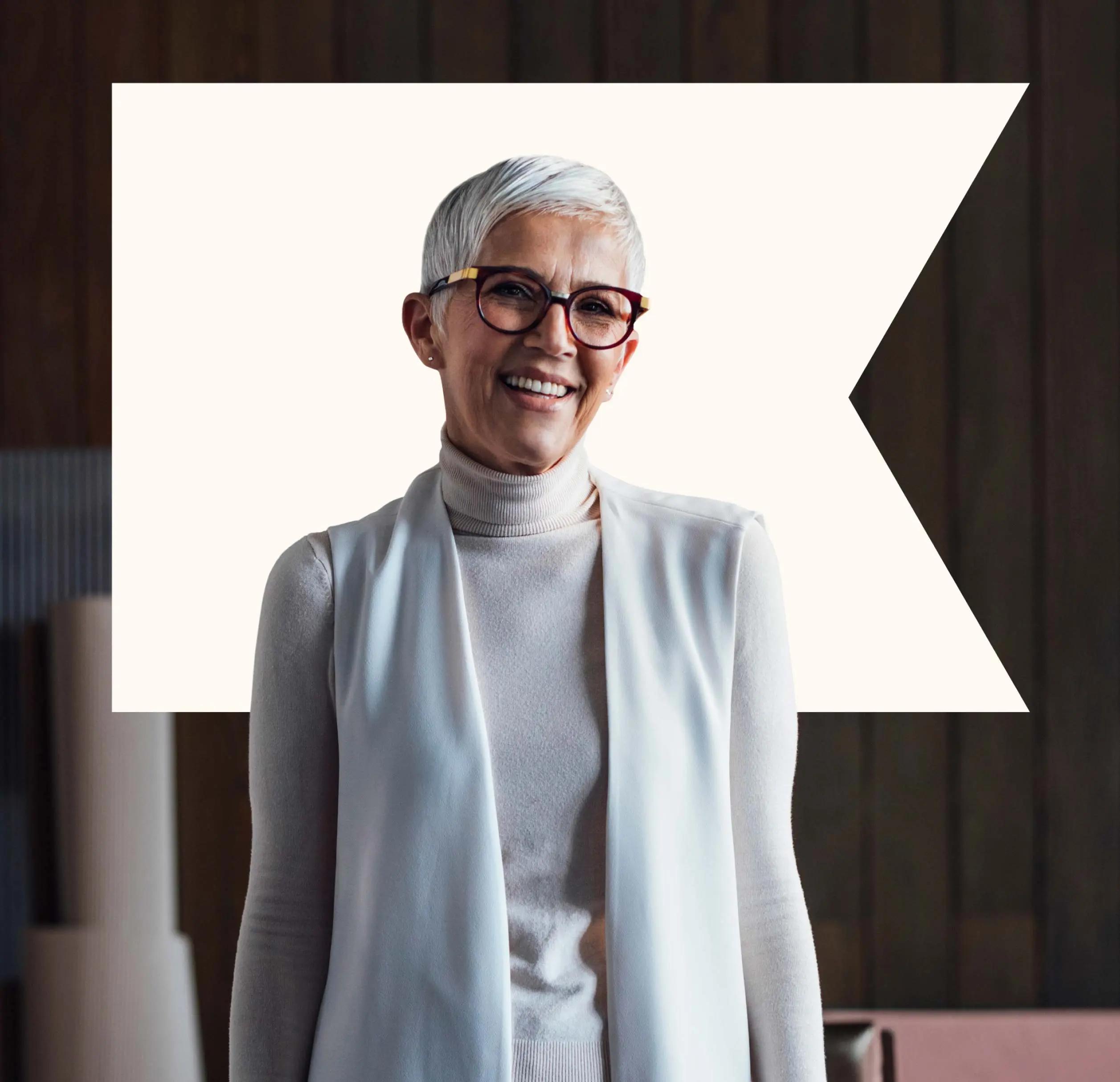 woman smiling with white klaviyo logo behind her