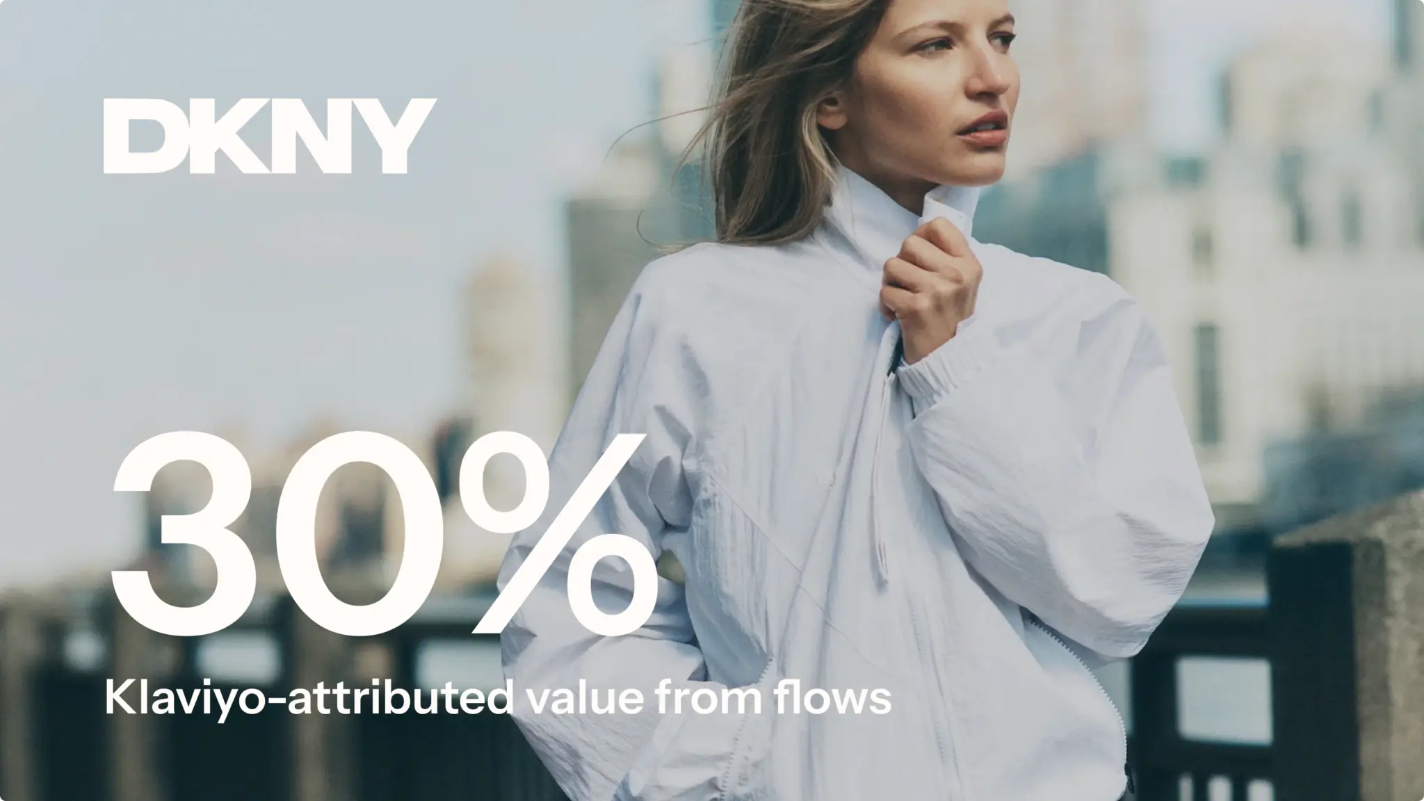 Woman in a white jacket outdoors, with DKNY logo and text: "30% Klaviyo-attributed value from flows.