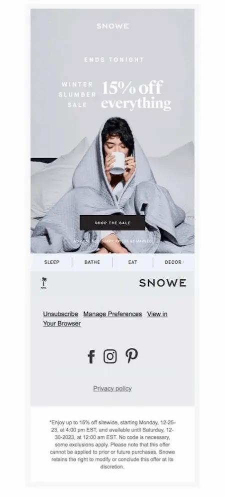 Image shows a New Year’s marketing campaign from home essentials brand Snow, featuring a photo of a person with dark hair wrapped in a blanket in bed, sipping from a mug. The email copy is simple and straightforward, reading, “ends tonight: winter slumber sale, 15% off everything,” with a “shop the sale” CTA button."