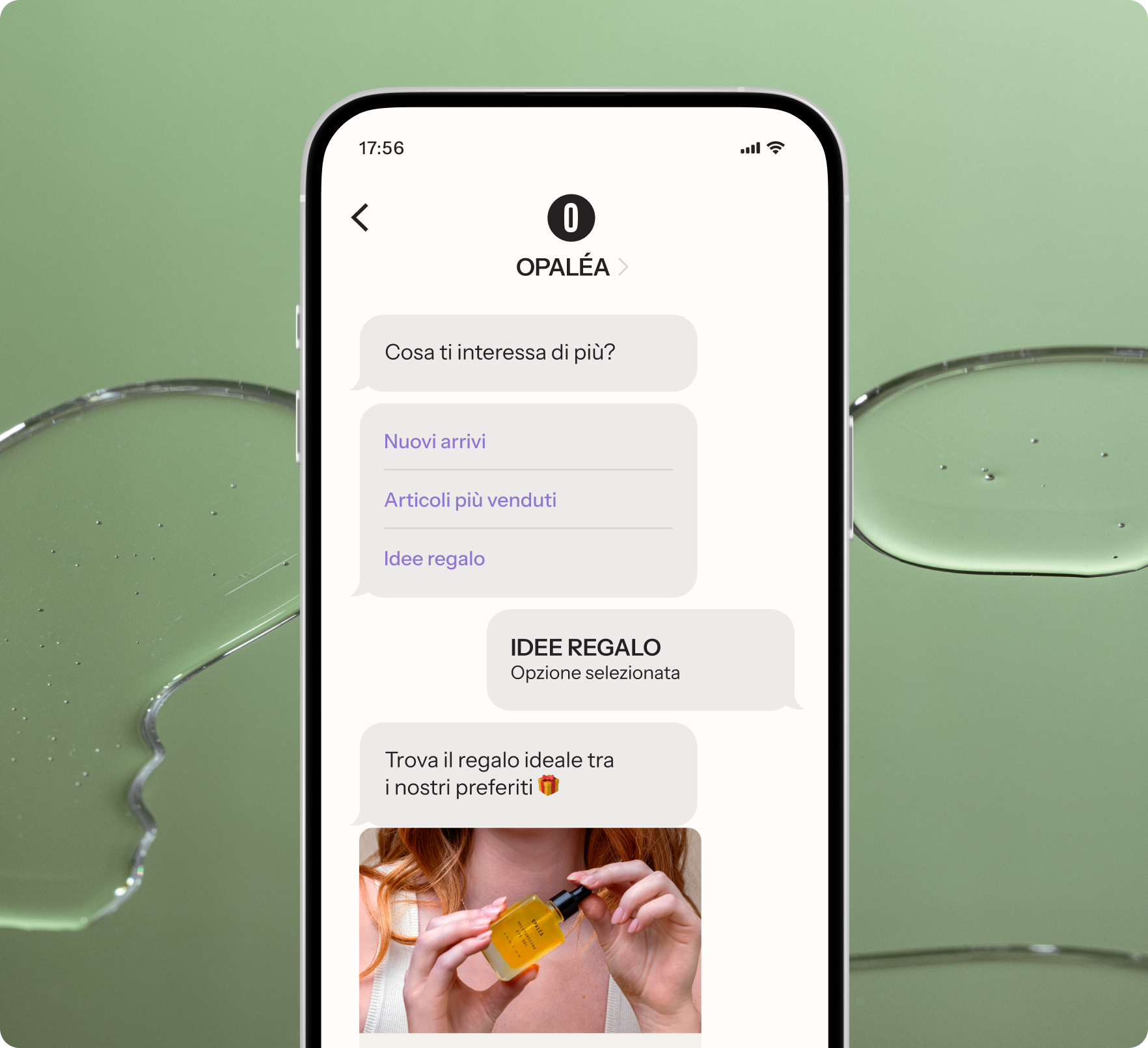 A smartphone displaying a shopping chatbot with gift ideas and a product image, against a green background with liquid spills.