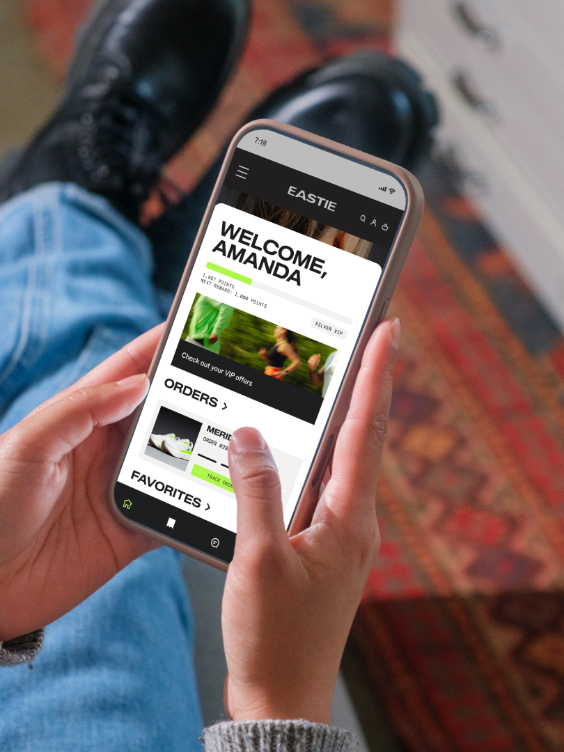Person browsing the Eastie rewards and orders dashboard on a smartphone