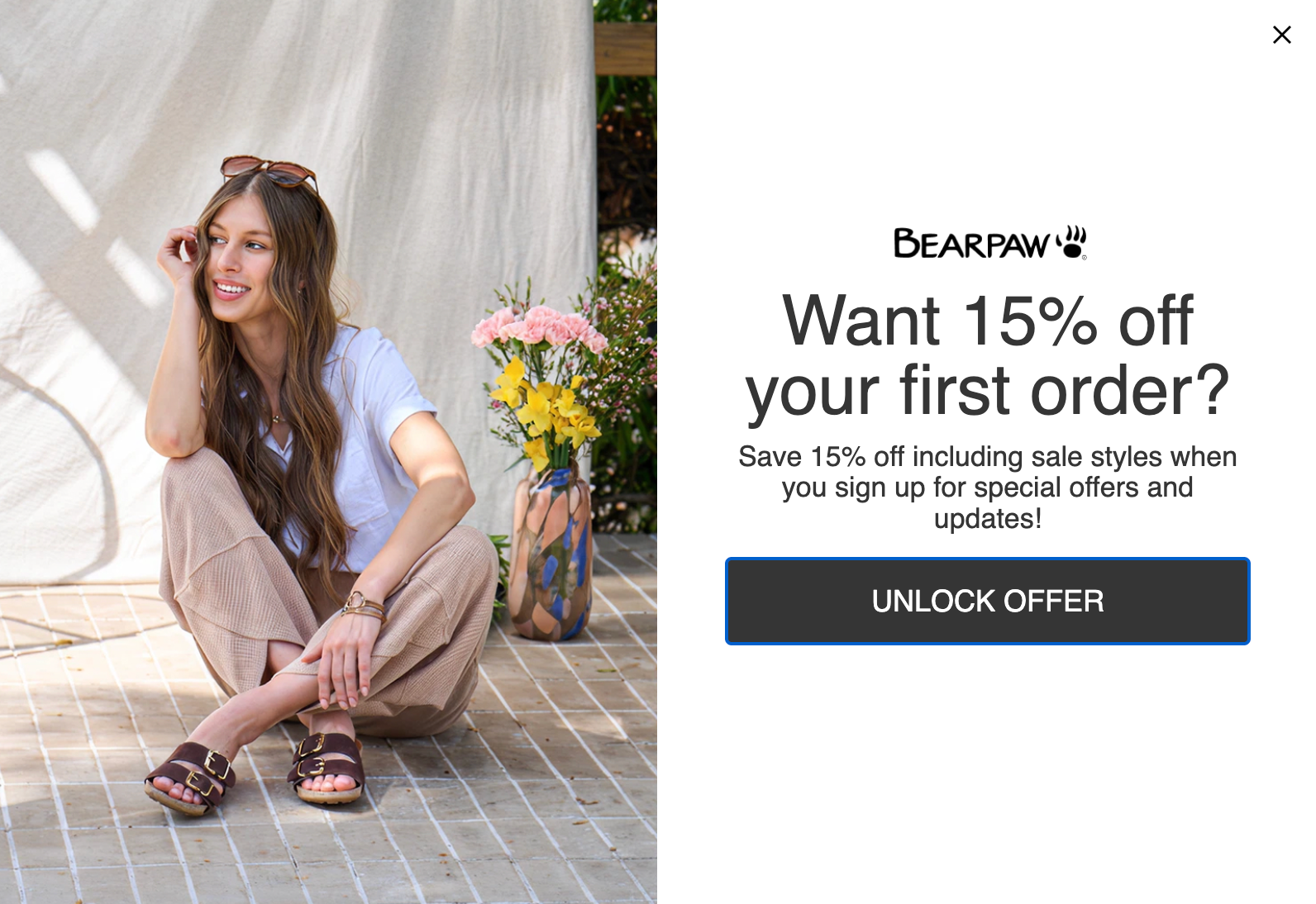 A woman wearing Bearpaw sandals next to a popup ad offering 15% off a first order.