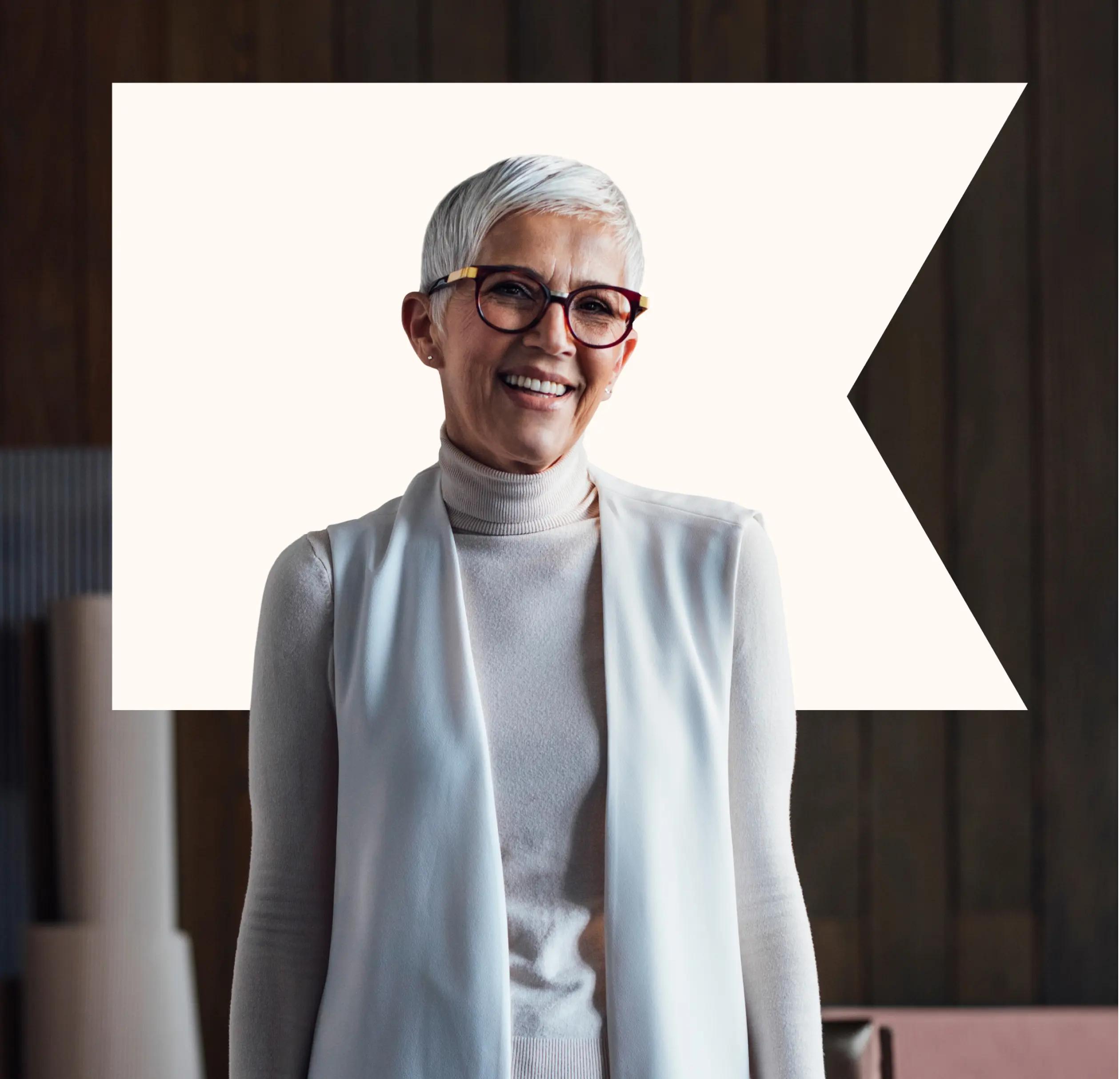 woman smiling with white klaviyo logo behind her