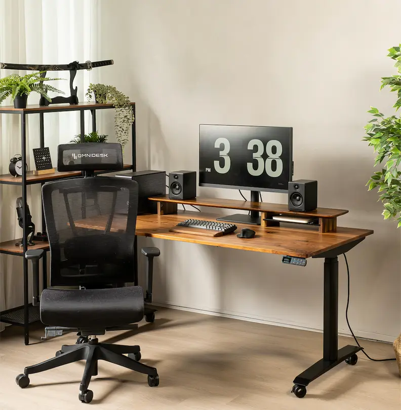A modern home office with a wooden standing desk, ergonomic chair, computer setup, and a bookshelf adorned with plants and a katana.