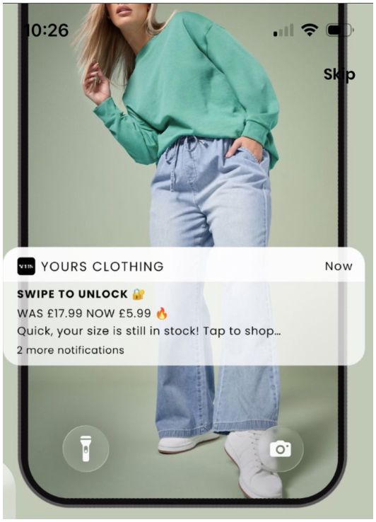 A smartphone screen displays a clothing ad with a woman in a green sweatshirt and jeans, overlaid with a "Yours Clothing" notification advertising a sale price of £5.99.