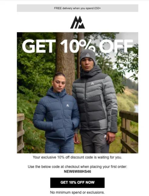 Image shows two people, one femme presenting and another masculine presenting, wearing warm, sporty jackets against a forest backdrop. The text on top of the image reads, “Get 10% off” with a black CTA button underneath that reads, “Get 10% off now”.