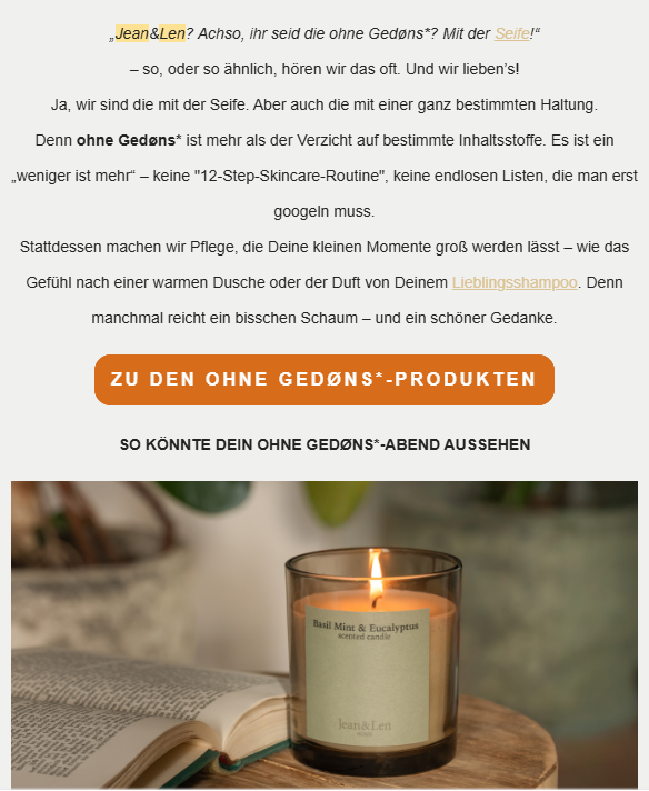 Screenshot of a German skincare brand webpage promoting “Ohne Gedøns” products by Jean & Len. The page contains descriptive text explaining the brand’s philosophy of simple skincare with fewer ingredients and no unnecessary additives. An orange call-to-action button reads “Zu den Ohne Gedøns*-Produkten.” Below, a section titled “So könnte dein Ohne Gedøns*-Abend aussehen” appears above an image of a lit candle labeled “Basil Mint & Eucalyptus scented candle” on a wooden surface next to an open book, creating a cozy evening atmosphere.
