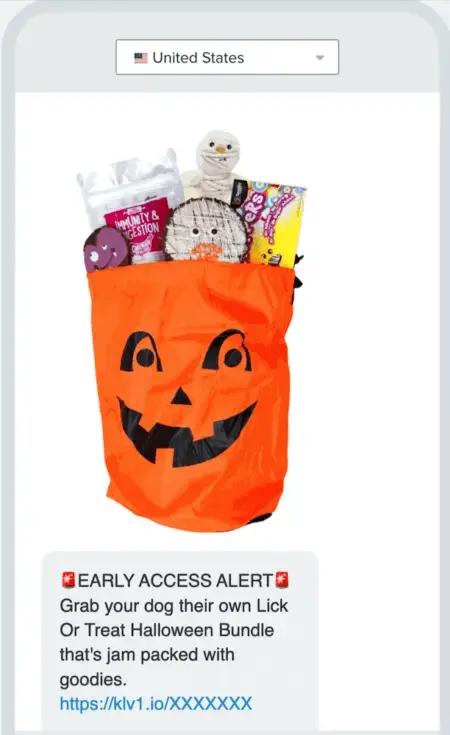 Image shows a Halloween marketing text message from The Dog Bakery, featuring a photo of a Halloween treat bundle, two siren emojis, and the copy, “EARLY ACCESS ALERT: Grab your dog their own Lick Or Treat Halloween Bundle that’s jam packed with goodies.”