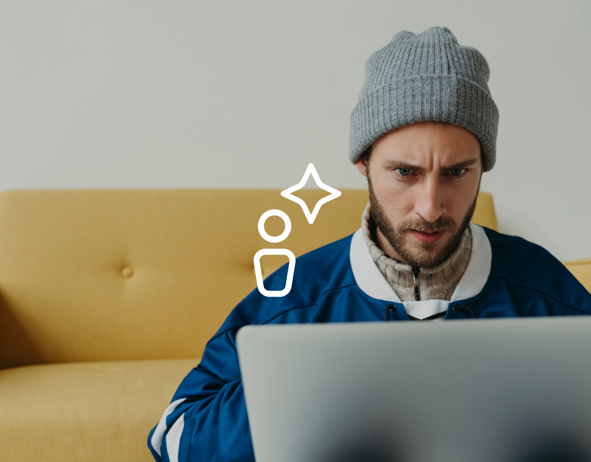 A photo of a man using a laptop computer.