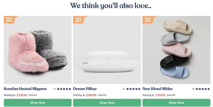 Komfies Heated Slippers, Dream Pillow, and New Kloud Slides with price drops. "Shop Now" buttons below each product.