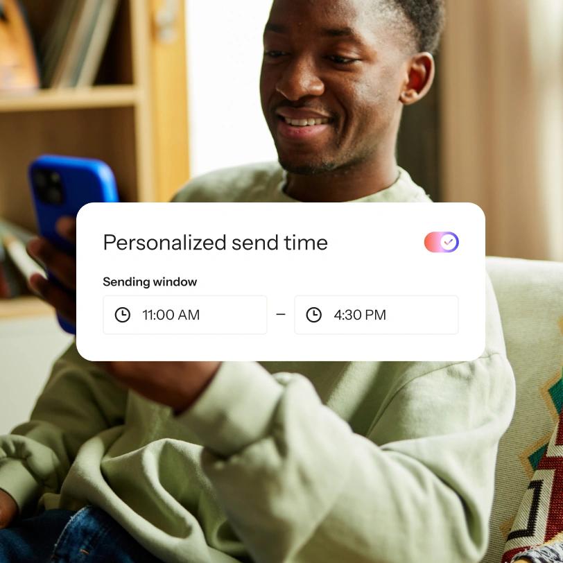 Smiling man uses a smartphone beneath a personalized send time overlay set from 11:00 AM to 4:30 PM.