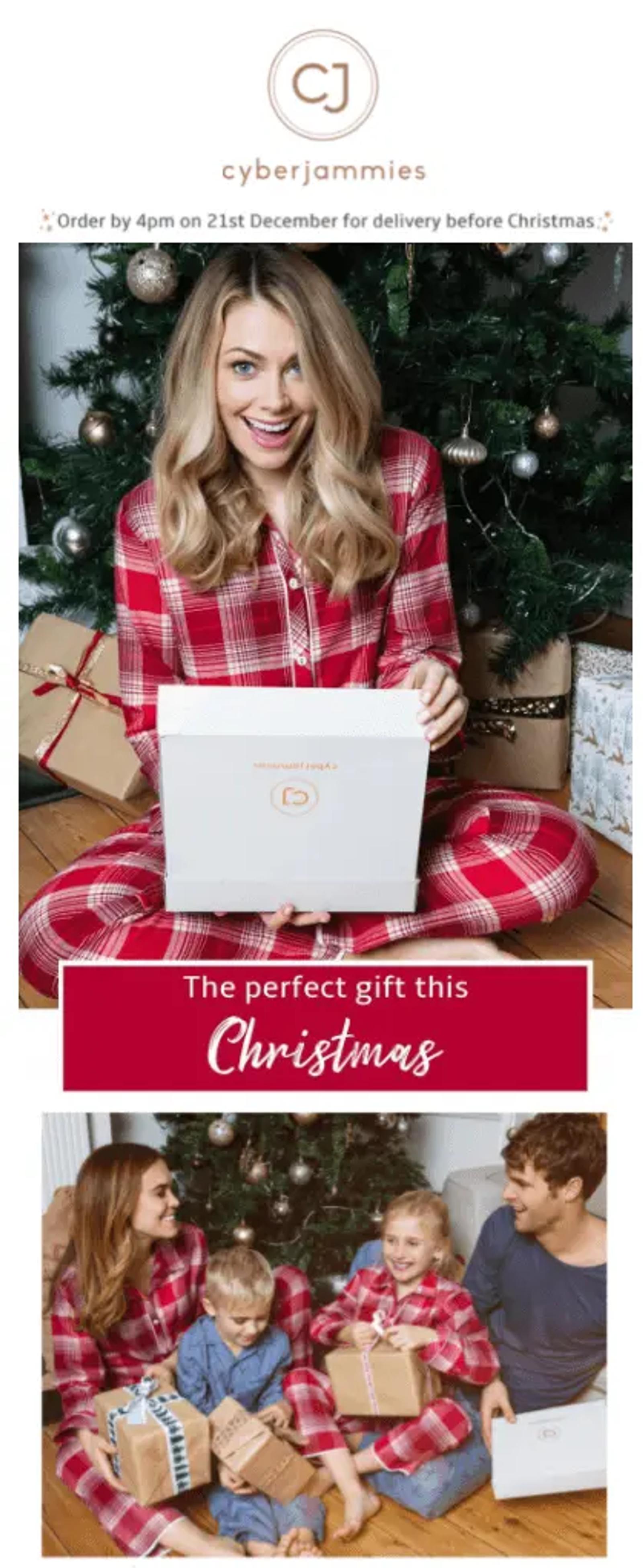 girl in red pjs opening a christmas present