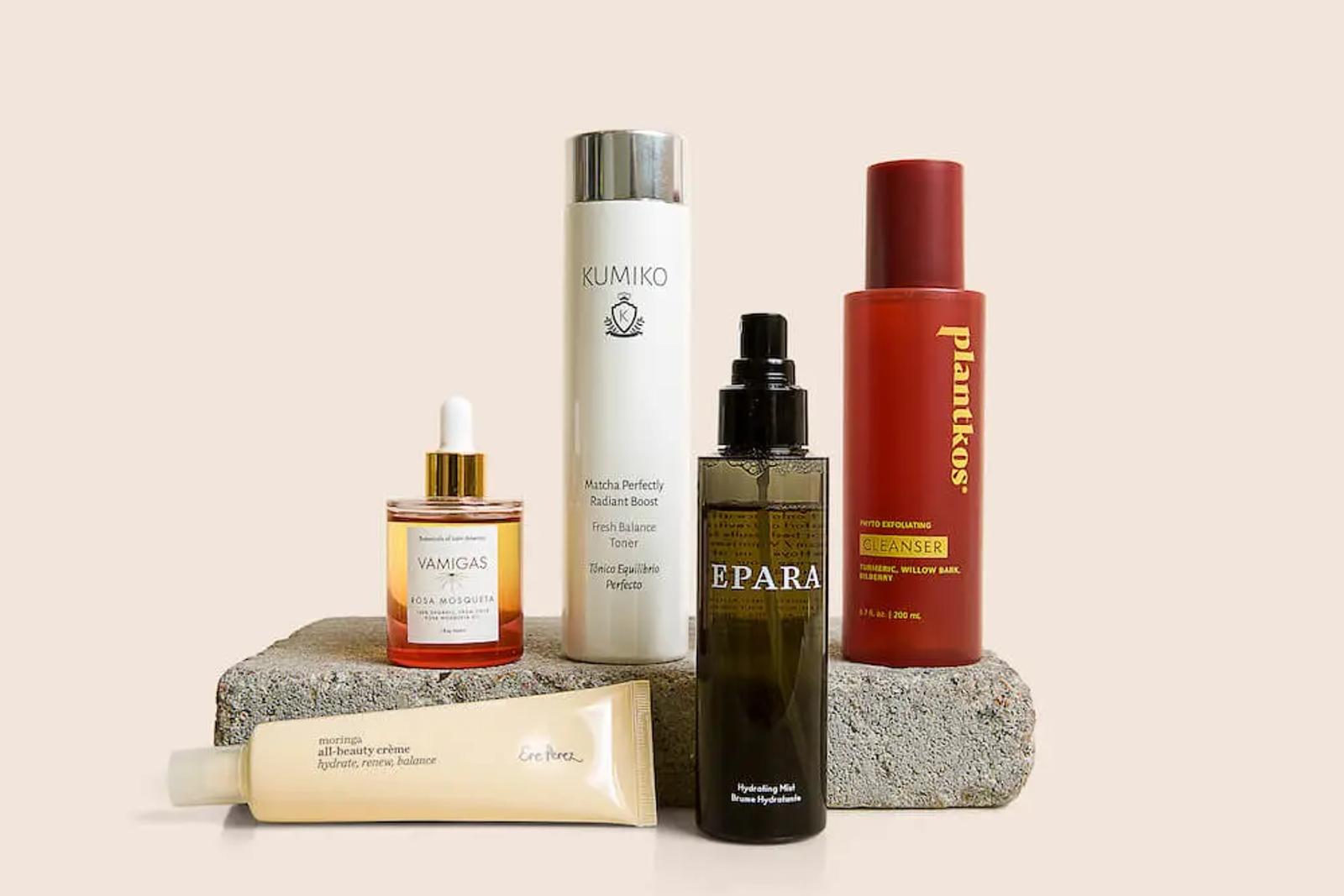 Image shows several bottle of makeup.
