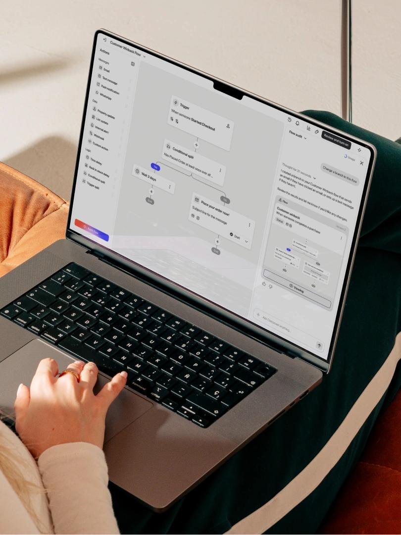Person using a laptop to build an automated customer feedback workflow