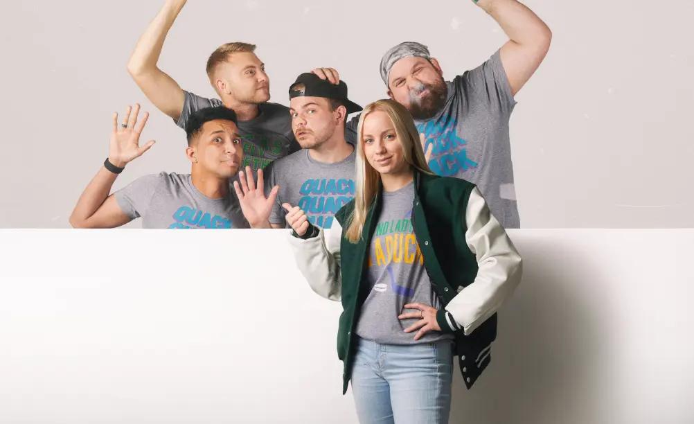 A group of people standing and wearing apparel from HOMAGE.