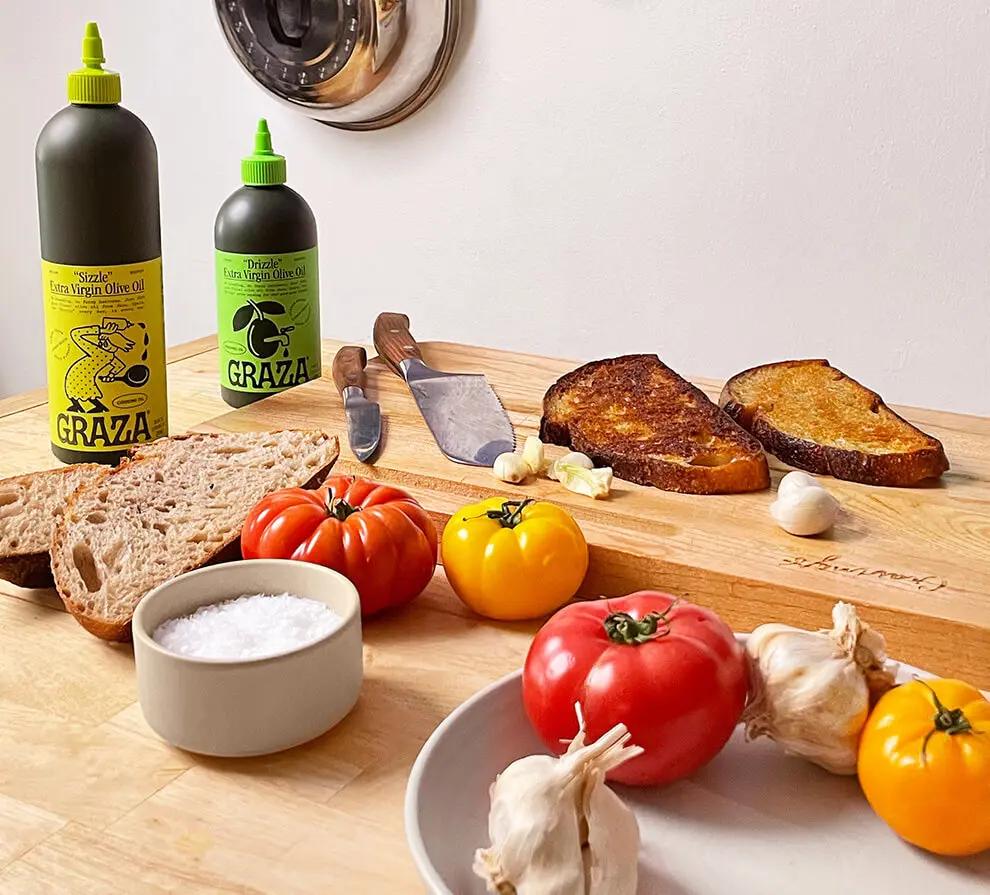 Graza, Klaviyo email client food products displayed on wooden table.