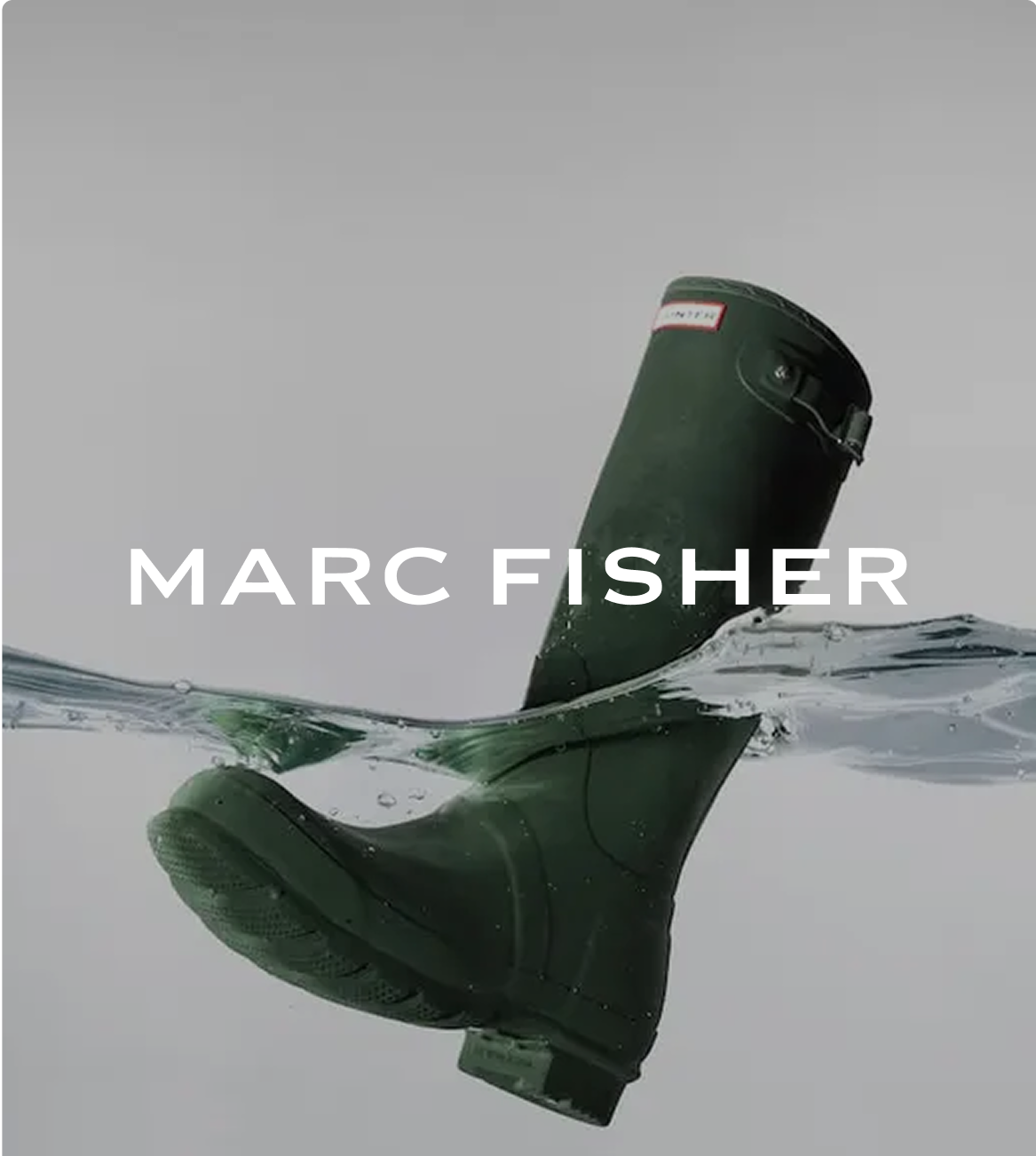 Dark green Hunter rain boot partially submerged in splashing water with "MARC FISHER" text overlay.