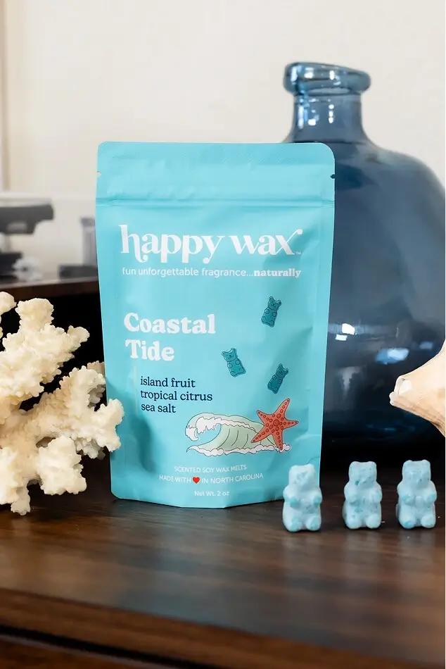 Happy Wax Coastal Tide scented soy wax melts displayed with blue bear-shaped melts and coastal decor.