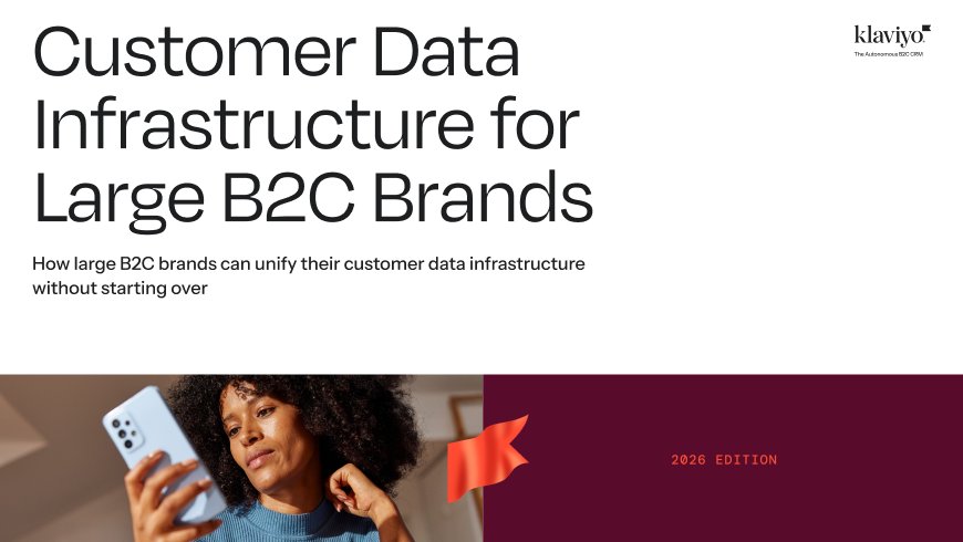 Cover for Klaviyo's 'Customer Data Infrastructure for Large B2C Brands (2026 Edition)', featuring a woman looking at her phone.