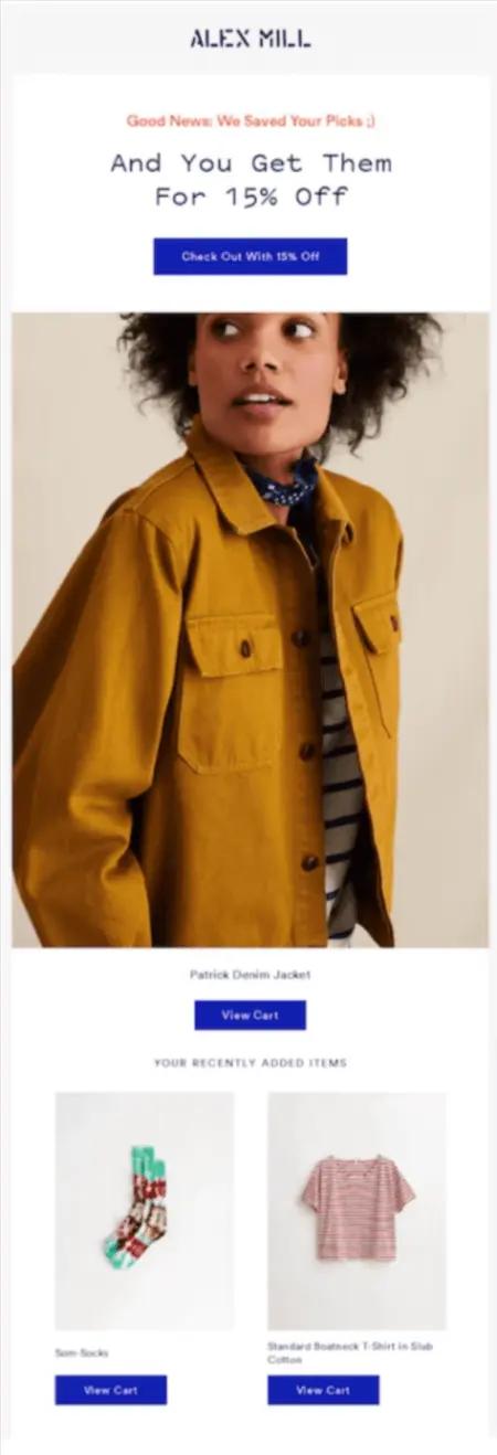 Image shows an abandoned cart email from apparel brand Alex Mill, which kicks off with the copy, “Good news, we saved your picks ;) and you get them for 15% off.” After a CTA button that reads, “Check out with 15% off,” the email contains an image of a dark-skinned person wearing a tan jacket, followed by another CTA button, “View Cart.” At the bottom is a section called “Your recently added items,” which contains two more product shots, a pair of red and green socks on the left and a pink-striped t-shirt on the right.