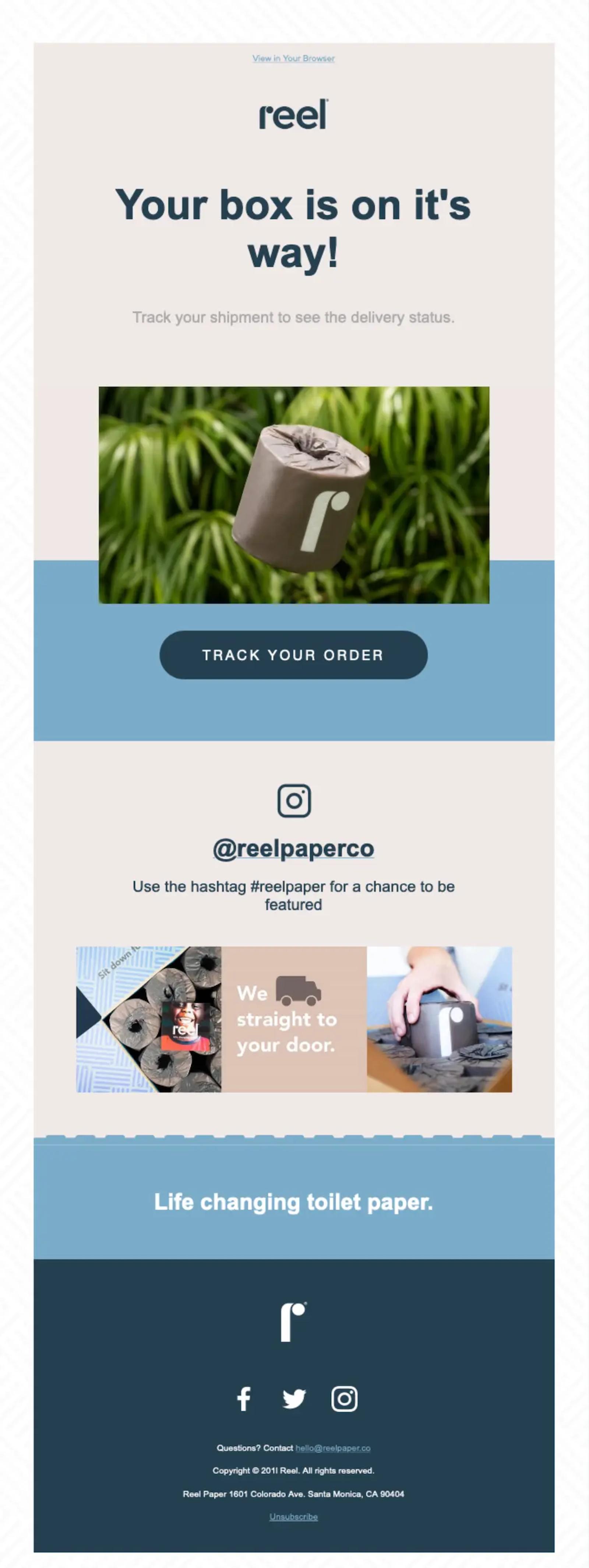 Reel's shipping confirmation email says "Your box is on it's way" with a picture of a roll of toilet paper, branded design, and a preview of their Instagram.