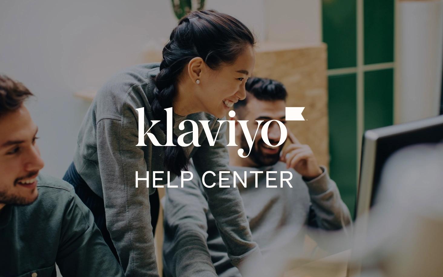 Three coworkers gathered around a computer with Klaviyo Help Center text overlaid