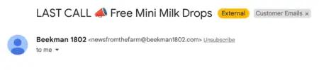Image shows a screenshot of the top of an email from skincare brand Beekman 1802. The subject line reads, “LAST CALL,” with a megaphone emoji: “Free Mini Milk Drops.” A yellow icon indicates the email is external, and there is a label that categorizes the email as part of “customer emails.”